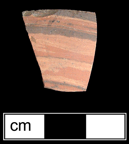 Biscuit fired thrown agateware sherd in unidentified hollow form, probably a teapot or jug.  This waster sherd is comprised of the blending of three different clay colors and was discarded prior to glazing - Agateware was one of the first earthenware ceramics to be fired twice: the first firing produced an unglazed, biscuit-fired vessel, which was then glazed and fired a second time - Collected by George L. Miller in 1986 in Staffordshire in Hanley.  Cannot be attributed to a specific pottery.